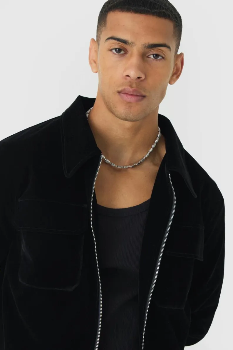 Shop boohooMAN Velour Trucker Jacket In black