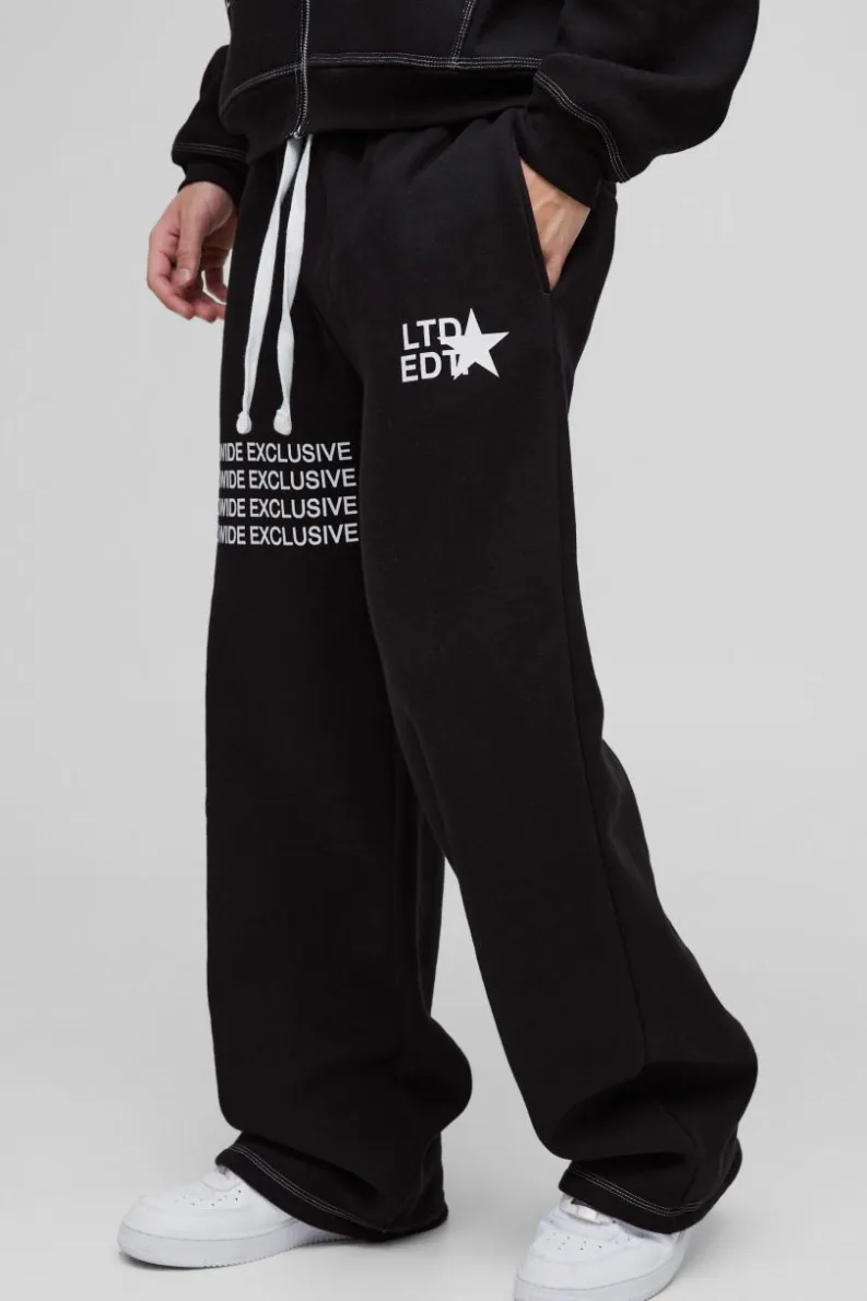 Shop boohooMAN Wide Leg Contrast Stitch Printed Joggers black