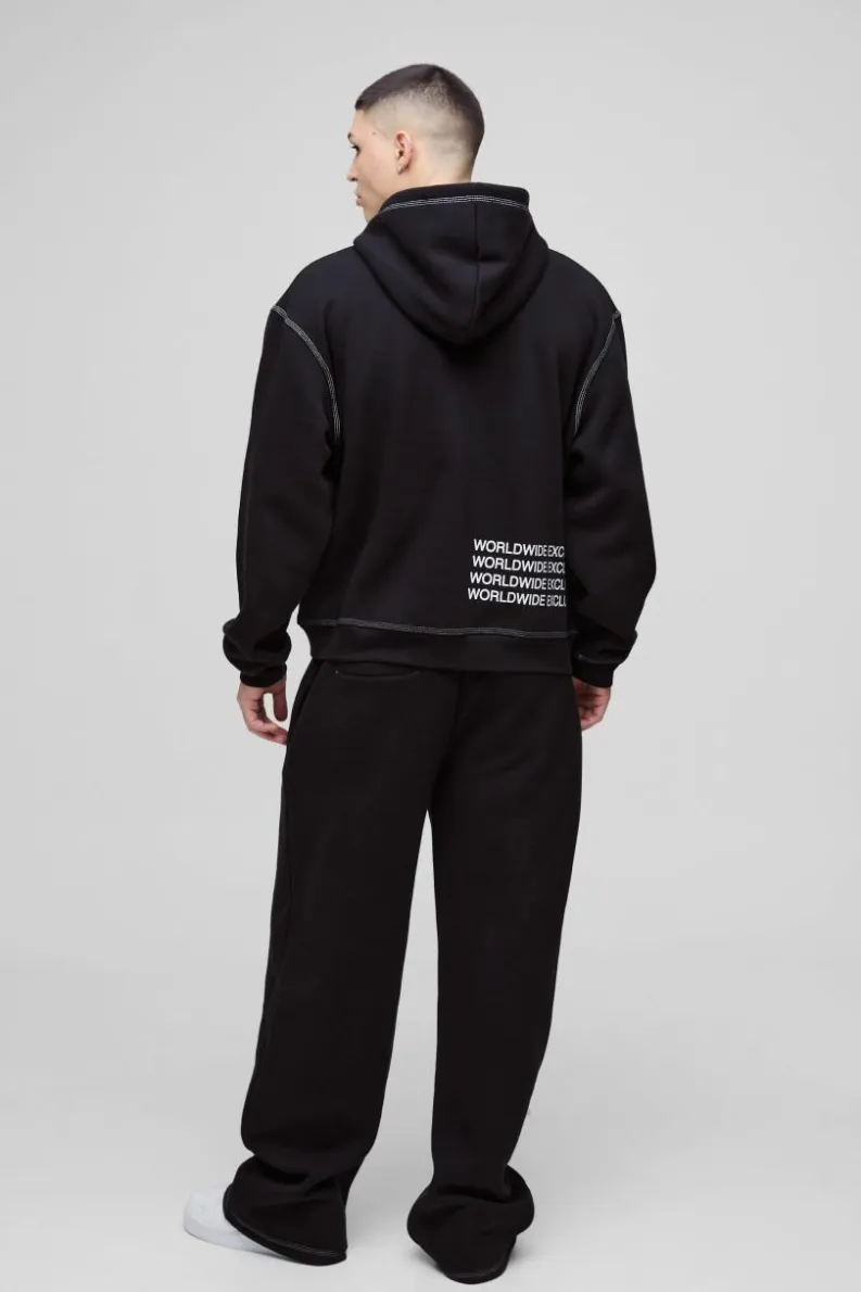 Shop boohooMAN Wide Leg Contrast Stitch Printed Joggers black