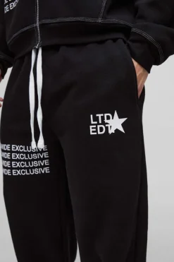 Shop boohooMAN Wide Leg Contrast Stitch Printed Joggers black