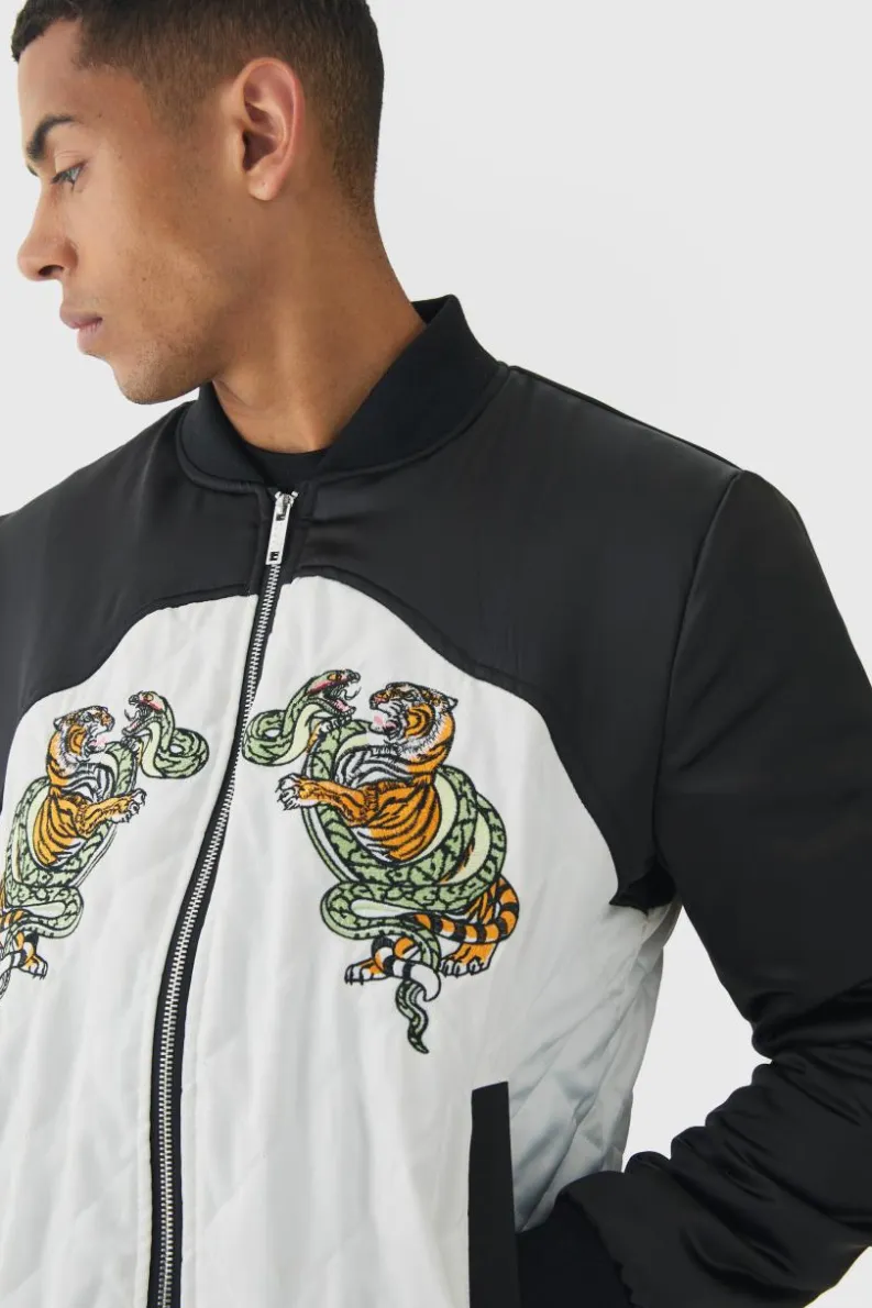 Online boohooMAN Worldwide Satin Quilted Padded Bomber Jacket In black
